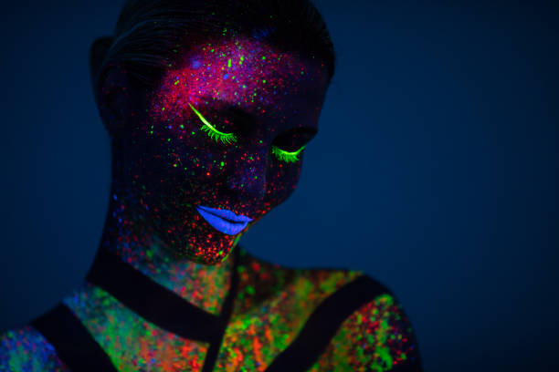 istock One woman painted with fluorescent make up 1138347988