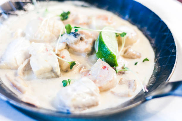 seafood cream saute with lime in pan in restaurant - grits prepared shrimp restaurant food imagens e fotografias de stock
