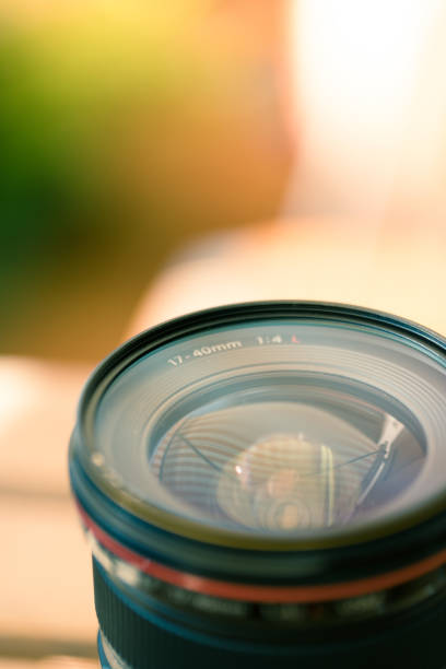 istock Professional optic photo lens outdoors. Warm colors, blurry background. 1138348836