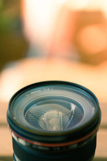 istock Professional optic photo lens outdoors. Warm colors, blurry background. 1138348842