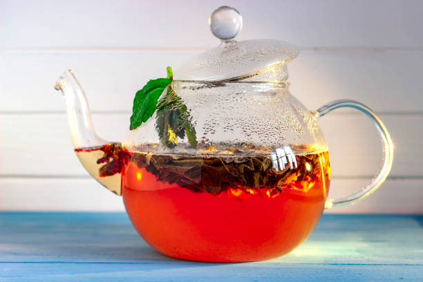 istock Teapot with tea isolated in white background 1138350083