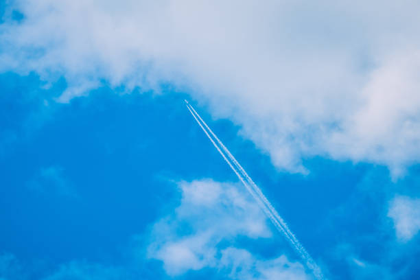 blue sky with airplane and white  trail