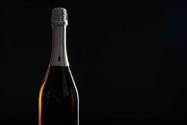 istock Bottle of champagne on black background. 1138352198