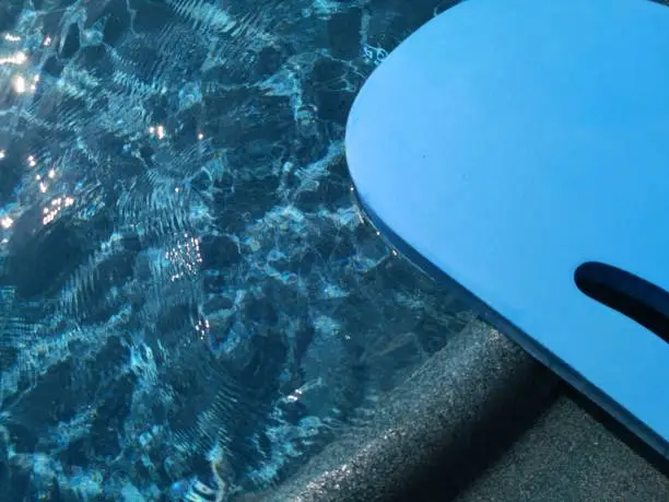Kickboard is placed beside the pool.