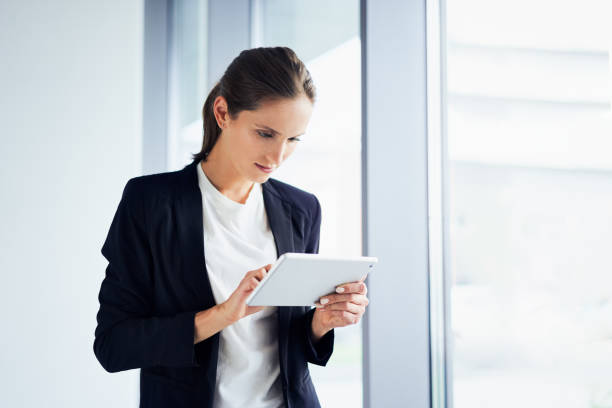 istock Businesswoman using digital tablet at corporate office 1138353254