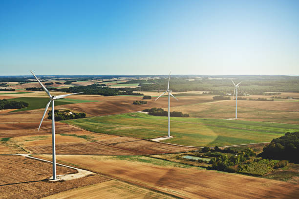 Those turbines love to spin High angle shot of wind turbines on an open landscape in the french countryside during the day largest cities in france stock pictures, royalty-free photos & images