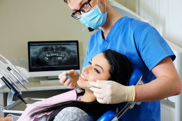 istock A dentist hands working on young woman patient with dental tools. 1138354031