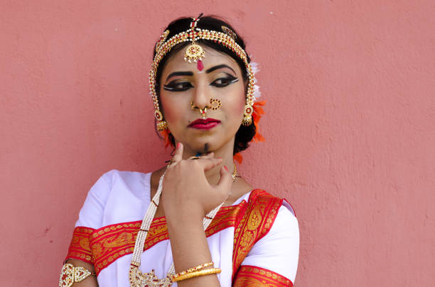 istock Indian classical dancer in traditional dress 1138355523