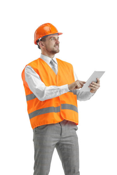 istock The builder in orange helmet isolated on white 1138355769