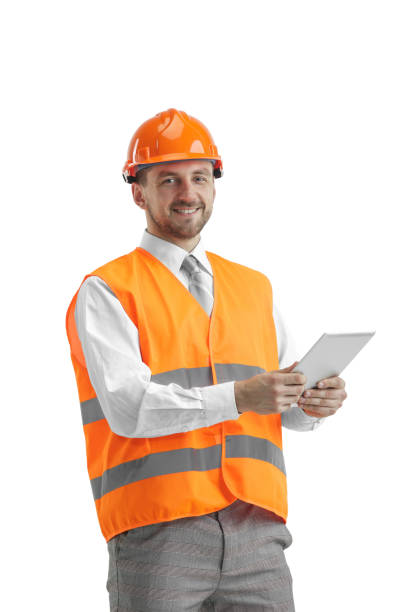 istock The builder in orange helmet isolated on white 1138355780