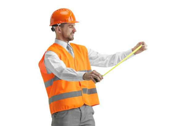istock The builder in orange helmet isolated on white 1138355785