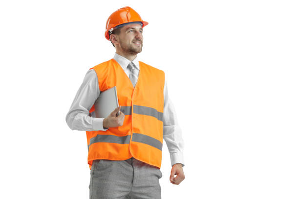 istock The builder in orange helmet isolated on white 1138355787
