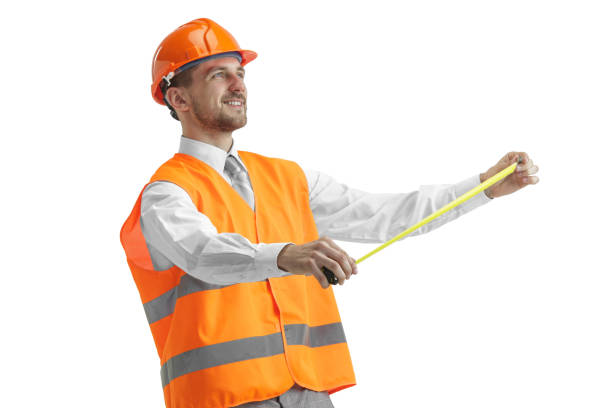 istock The builder in orange helmet isolated on white 1138355789