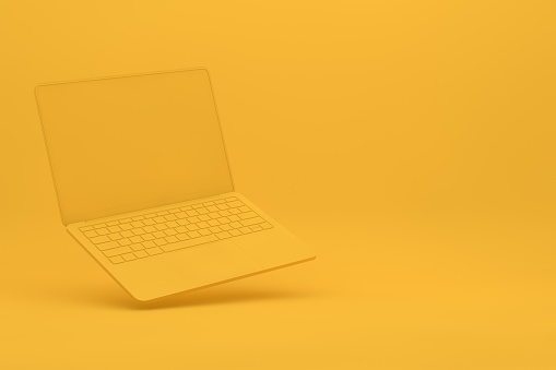 Laptop con pantalla vacía, concepto de tecnología minimalista, fondo amarillo photo