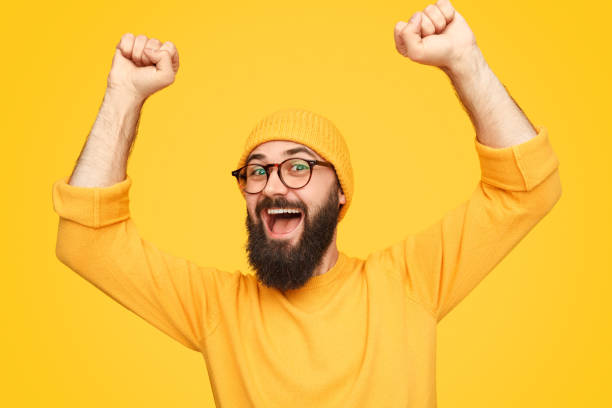 istock Bright colorful hipster with arms raised 1138358759
