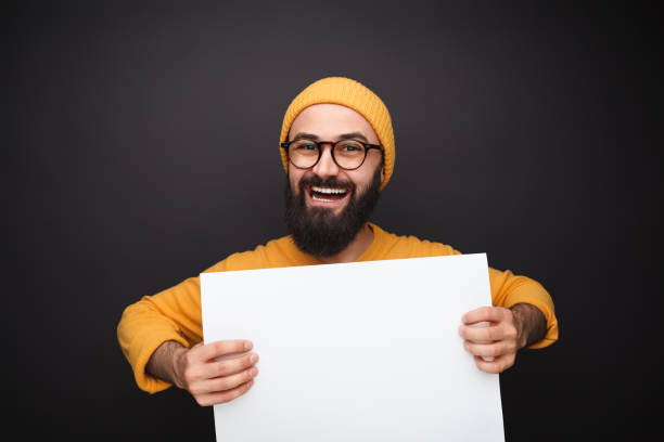 istock Funny male with blank paper 1138358785