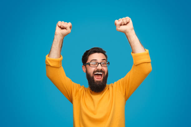 istock Funny man celebrating victory 1138358791