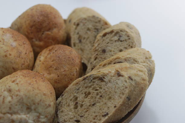 istock French Bread and Whole Wheat Breads in a Basket on White Background 1138359917