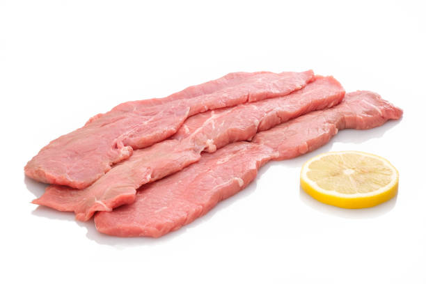 istock Three slices veal cutlet and lemon 1138360281