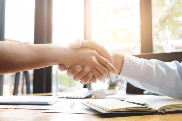 istock recruitment and interview concept , candidate with human resource manager handshaking. 1138360297