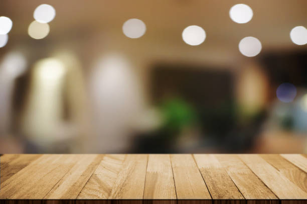 istock empty wood table top over blur night light in restaurant cafe background. 1138362178