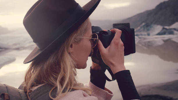 istock Female photographer at glacier lagoon 1138362353