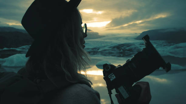 istock Female photographer at glacier lagoon 1138363027
