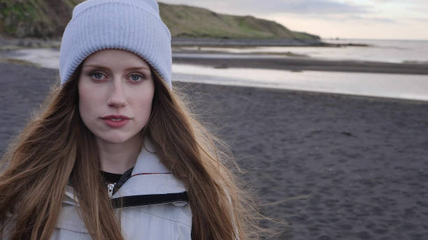 istock Beautiful, seductive woman posing on a black beach 1138363137