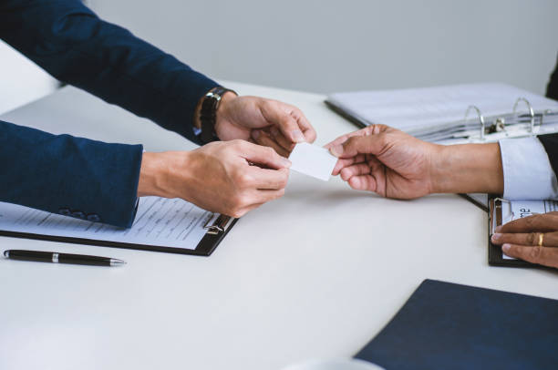 istock candidate giving a name card to human resource manager in a office, recruitment and interview concept. 1138364124