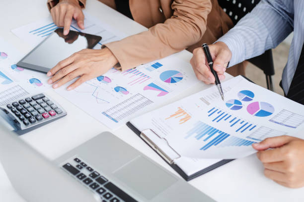 istock Investment and cooperate concept, business financial inspector analyzing about parformance data in office meeting. 1138364136