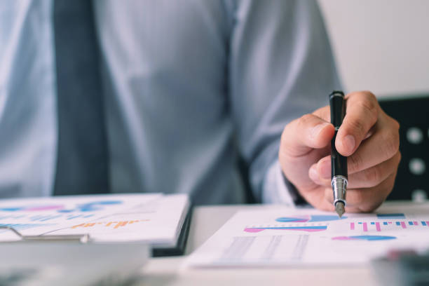 istock Investment and cooperate concept, business financial inspector analyzing about parformance data in office meeting. 1138364154