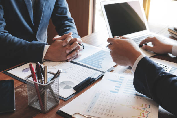 istock Investment and cooperate concept, business financial inspector analyzing about parformance data in office meeting. 1138364262