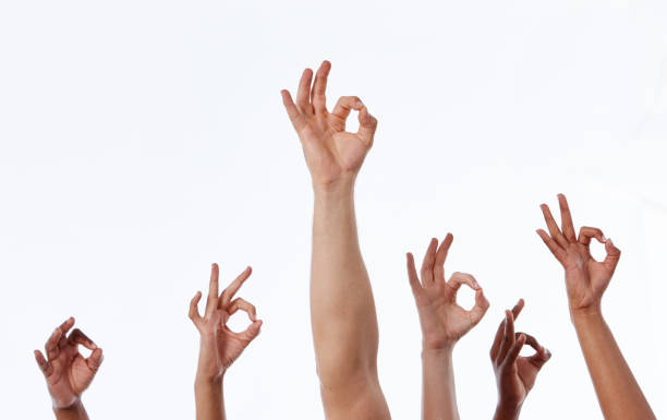 istock Six raised hands make OK hand signs 1138364274