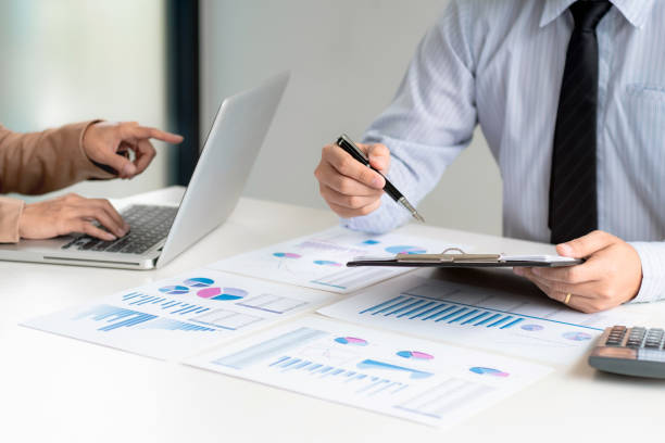 istock Investment and cooperate concept, business financial inspector analyzing about parformance data in office meeting. 1138365422