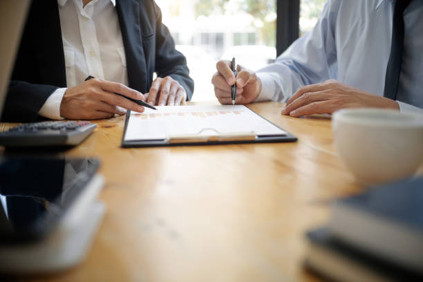 istock Investment and cooperate concept, business financial inspector analyzing about parformance data in office meeting. 1138365451