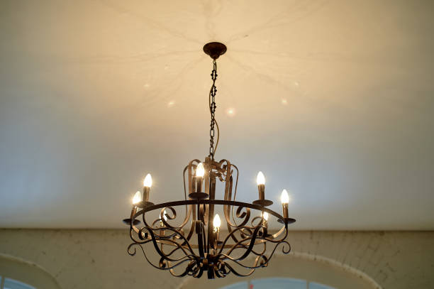 istock Wrought iron chandelier on the ceiling.Loft style 1138365630