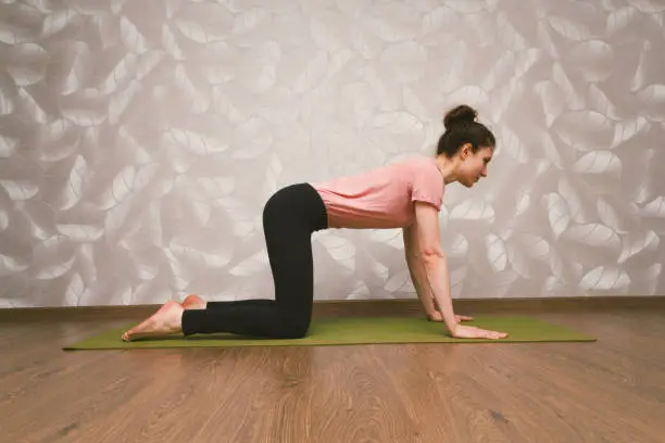 Photo of woman practising yoga,home yoga concept