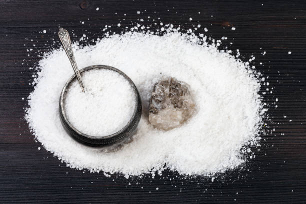 istock top view of silver salt cellar and rough Halite 1138367557