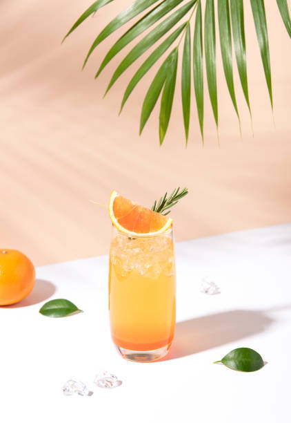 istock Cold and refreshing orange punch cocktail with orange slice on color background. summer drink. 1138368908