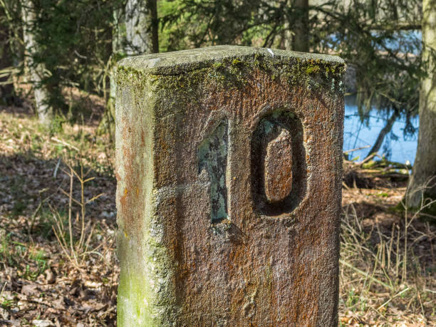 istock Number 10 carved in a kilometer stone along a disused railway track 1138368917