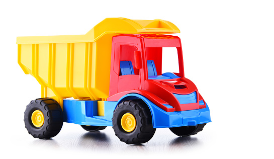Colorful plastic truck toy isolated on white.