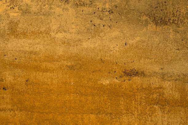 istock pretty grunge orange stone like stucco texture for design purposes. 1138369465