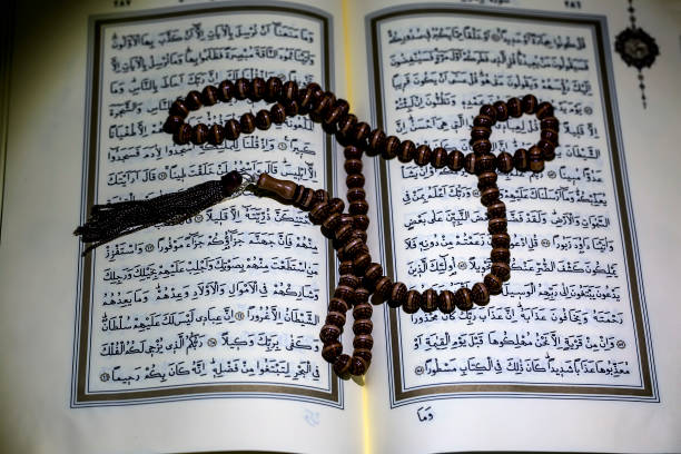 istock Islamic Book Koran with rosary on background 1138369959