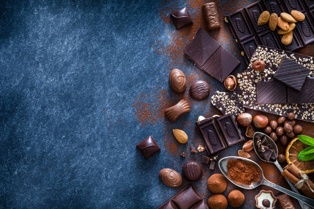 istock Chocolate assortment and cocoa powder with copy space shot from above 1138370040