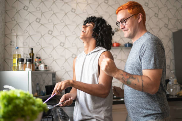 istock Gay couple having fun cooking together 1138370251