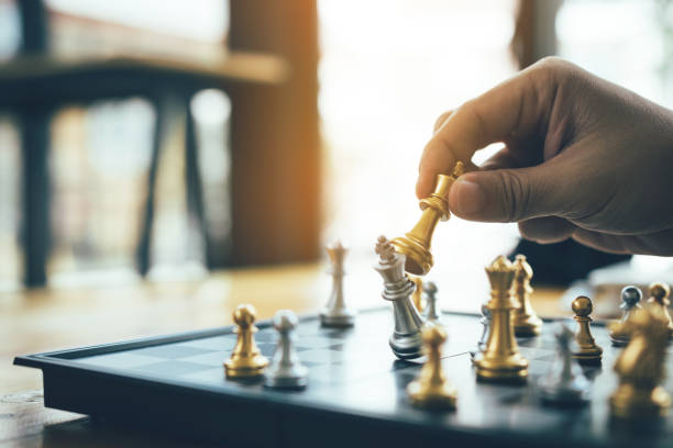 istock Businessman playing chess game beat opponent with strategy concept. 1138370434