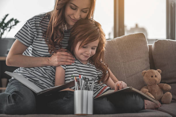 Woman and child drawing with enjoyment