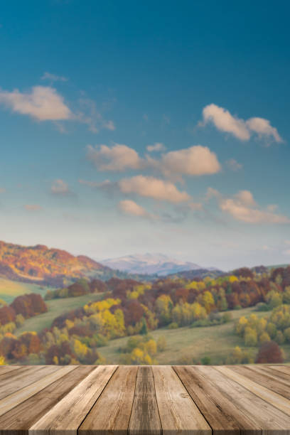 istock Autumn mountains landscape, blurred. Wooden table top product display 1138372321