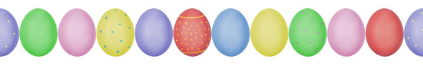 istock Close up photo of colorful painted Easter eggs with eggshell texture arranged in a row. Seamless pattern. Isolated on white background. 1138373288