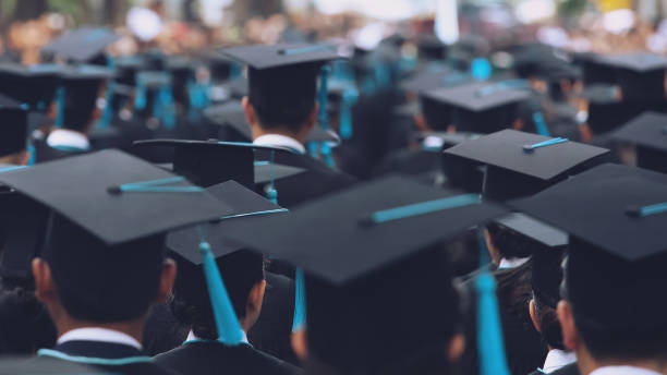 istock close up hat group of Graduates during commencement. Concept education congratulation in University. Graduation Ceremony in University during commencement. 1138373747
